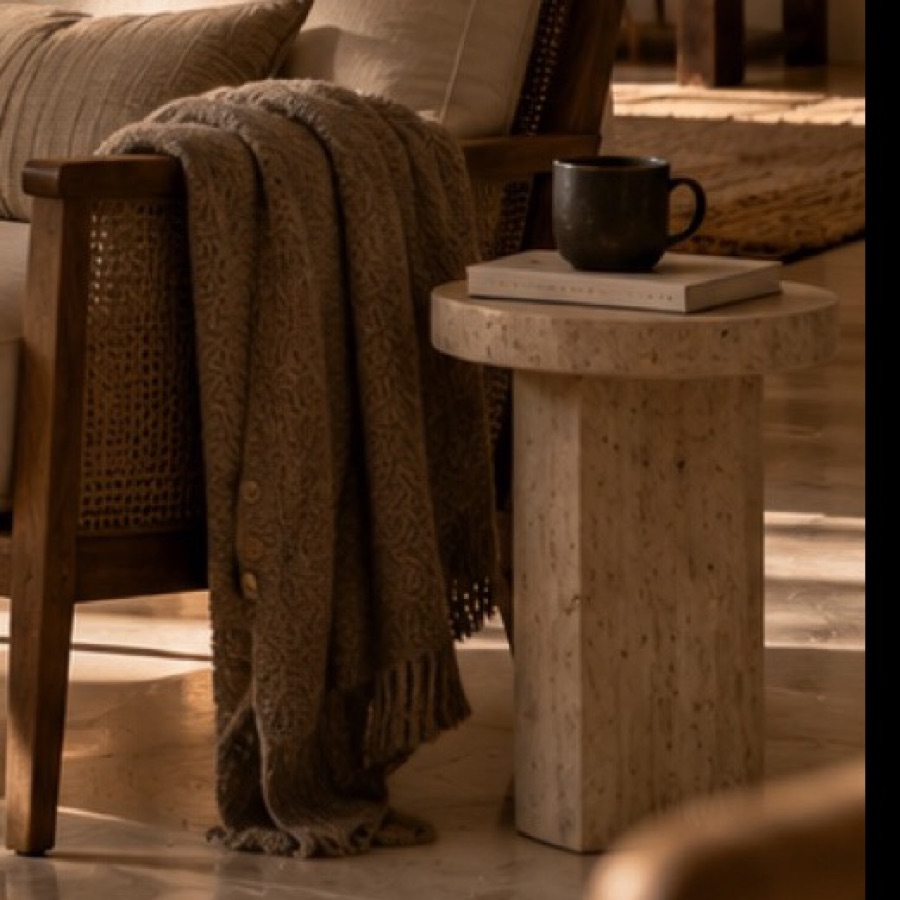 Solid travertine side table